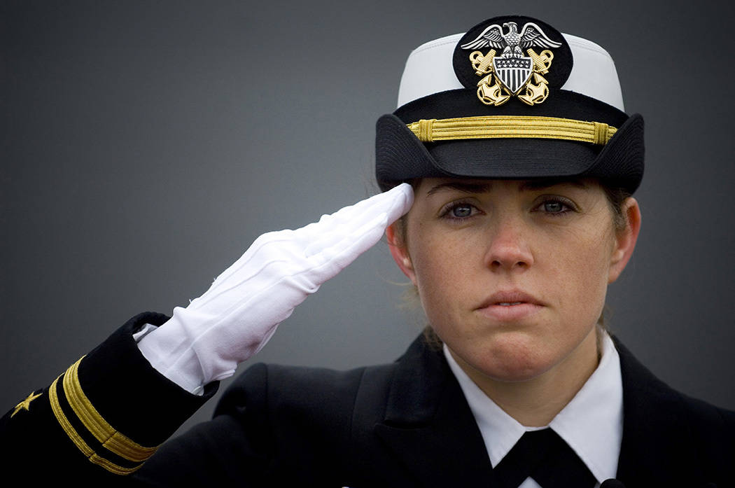 081108-N-5549O-035 MILWAUKEE (Nov. 8, 2008) Ship's Navigator Lt. j.g. Shaina Hayden renders honors to the national anthem during the commissioning ceremony for the littoral combat ship USS Freedom (LCS 1) at Veterans Park in Milwaukee, Wis. Freedom is the first of two littoral combat ships designed to operate in shallow water environments to counter threats in coastal regions. (U. S. Navy photo Mass Communication Specialist 2nd Class Kevin S. O'Brien/Released)