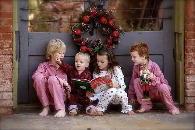 Children reading The Grinch by Dr. Seuss