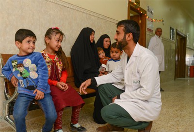 Volunteer doctor with children