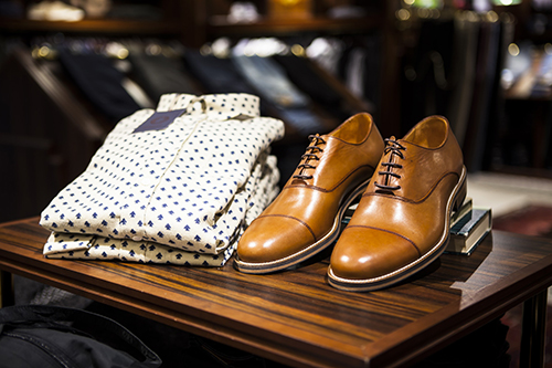 Mens dress shirt and shoes on display